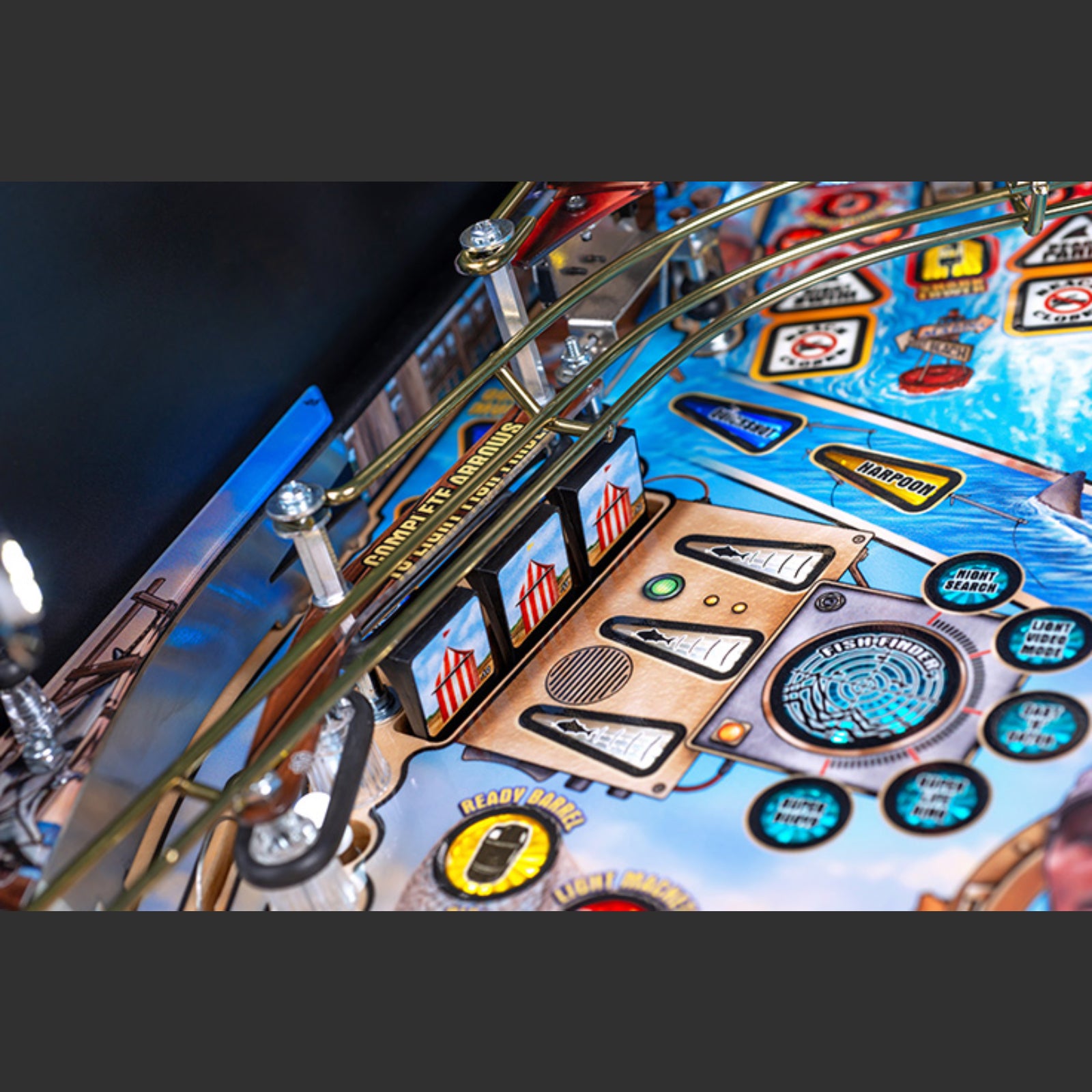 Nitro Pinball Sales Jaws 50th Annyversary Close-up of a pinball machine with colorful artwork and playing field.