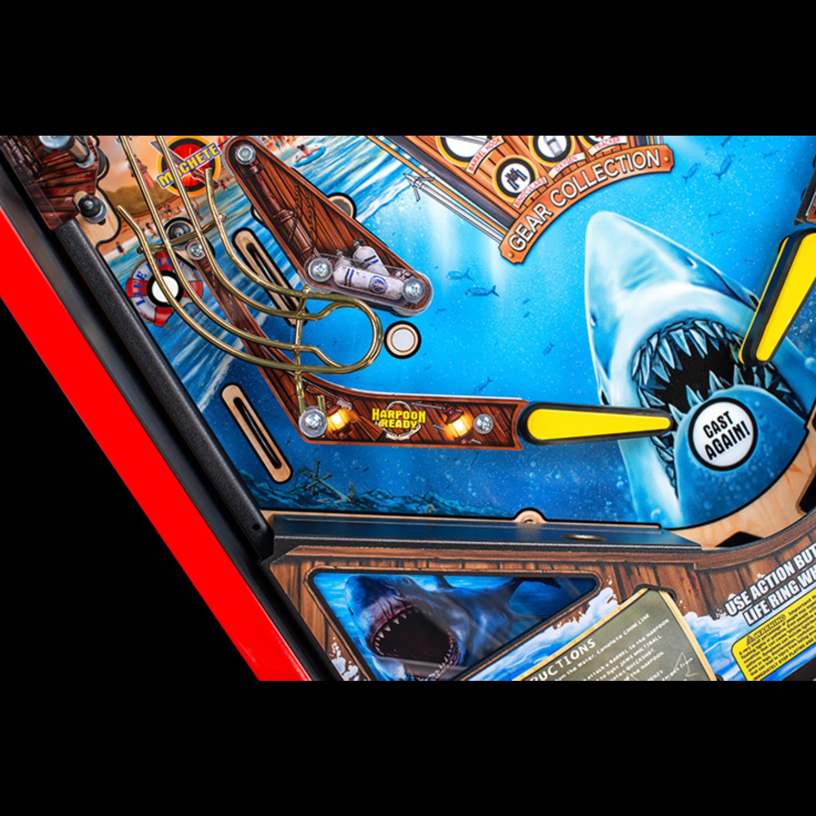 Nitro Pinball Sales Jaws 50th Annyversary Close-up of a pinball machine with shark design and red border