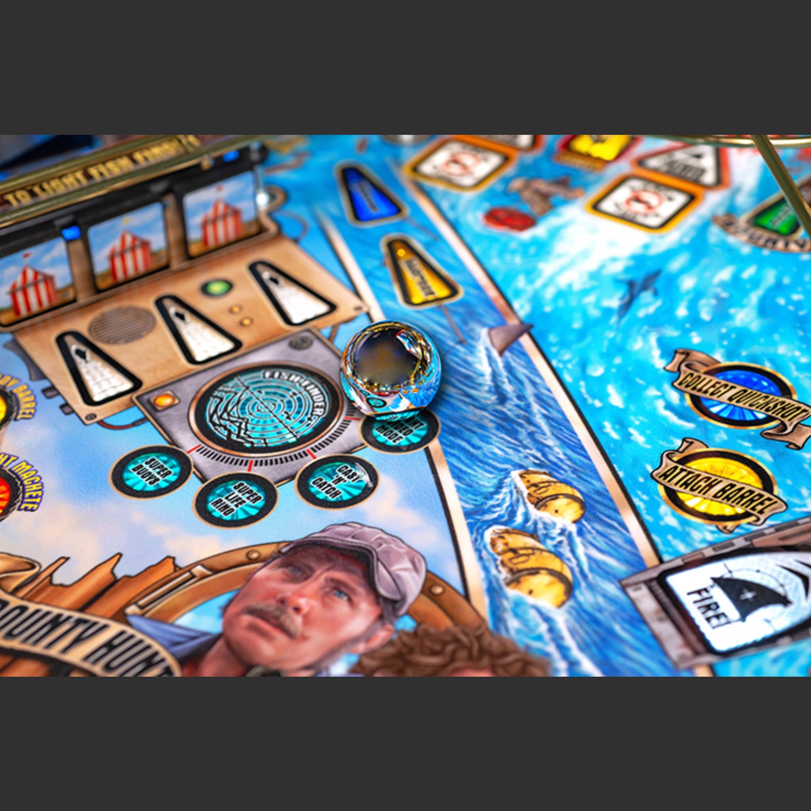 Nitro Pinball Sales Jaws 50th Annyversary Close-up of a pinball machine with detailed artwork and player figure.