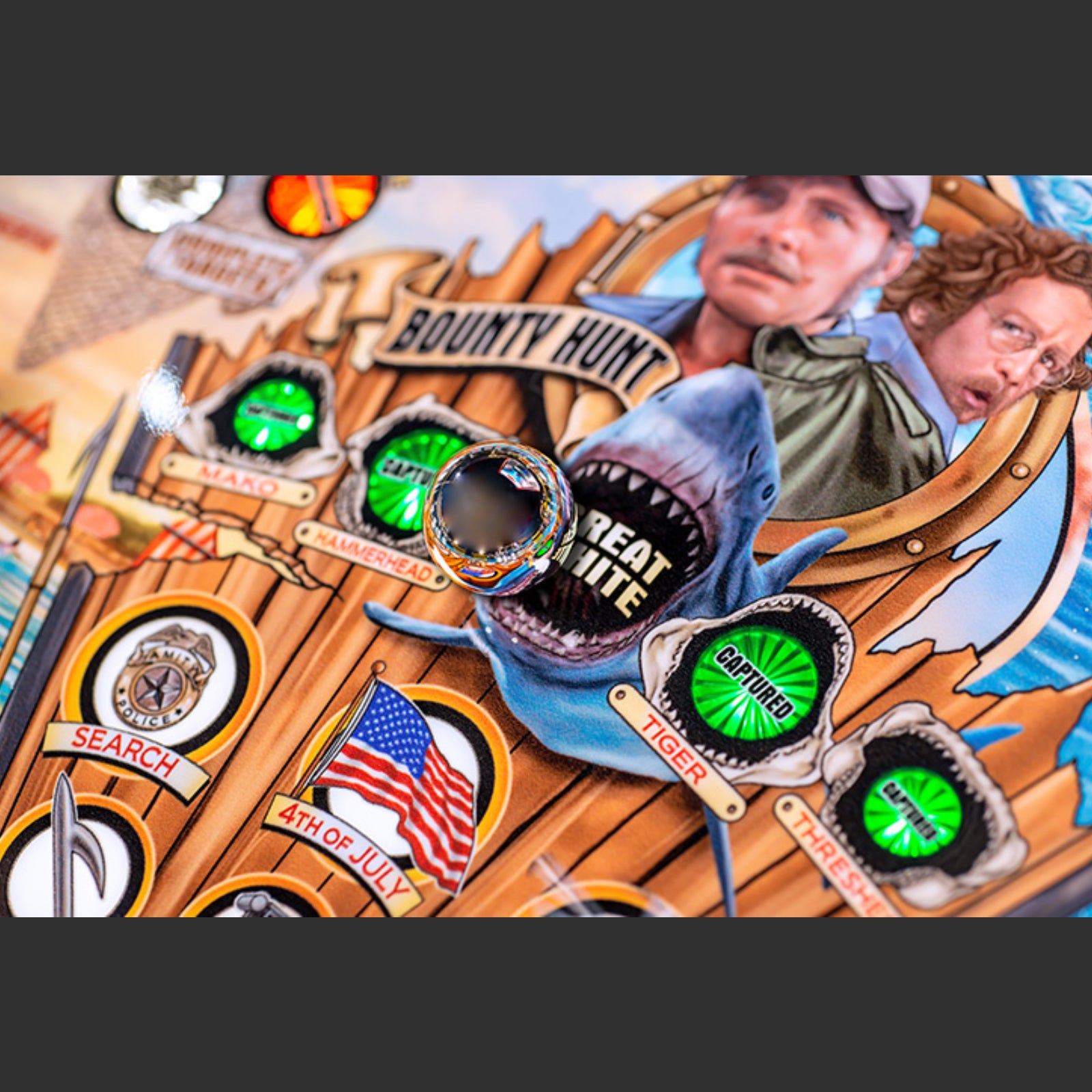 Nitro Pinball Sales Jaws 50th Annyversary Decorative mat with shark design, American flag, and text on a wooden background