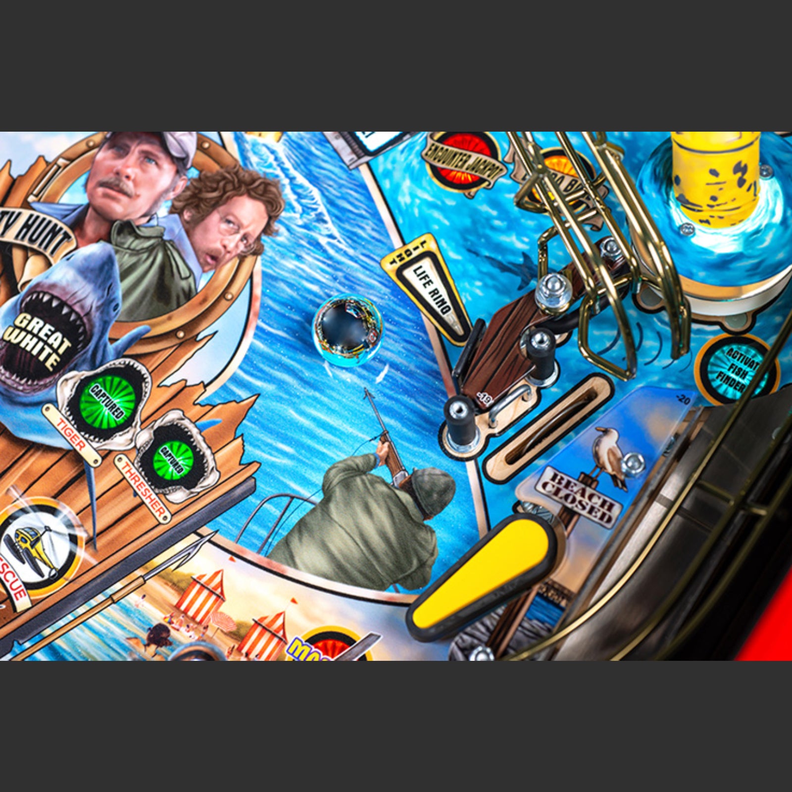 Nitro Pinball Sales Jaws 50th Annyversary Close-up of a pinball machine with shark and boat graphics