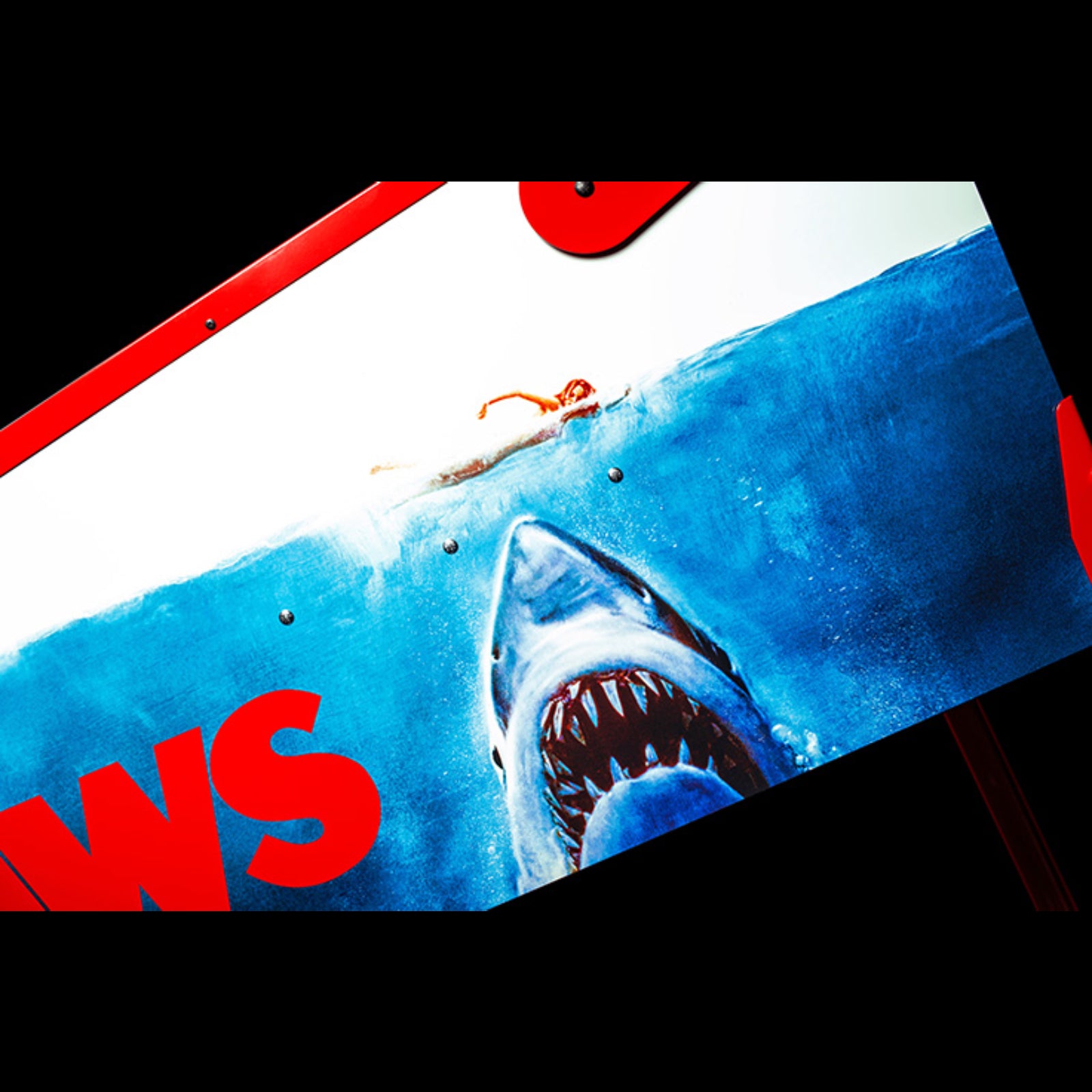 Nitro Pinball Sales Jaws 50th Annyversary Movie poster with a shark and a person in the water, featuring the word 'NEWS'.