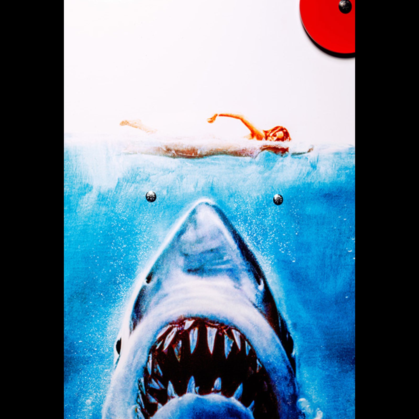 Nitro Pinball Sales Jaws 50th Annyversary Shark emerging from water with a person on a surfboard in the background