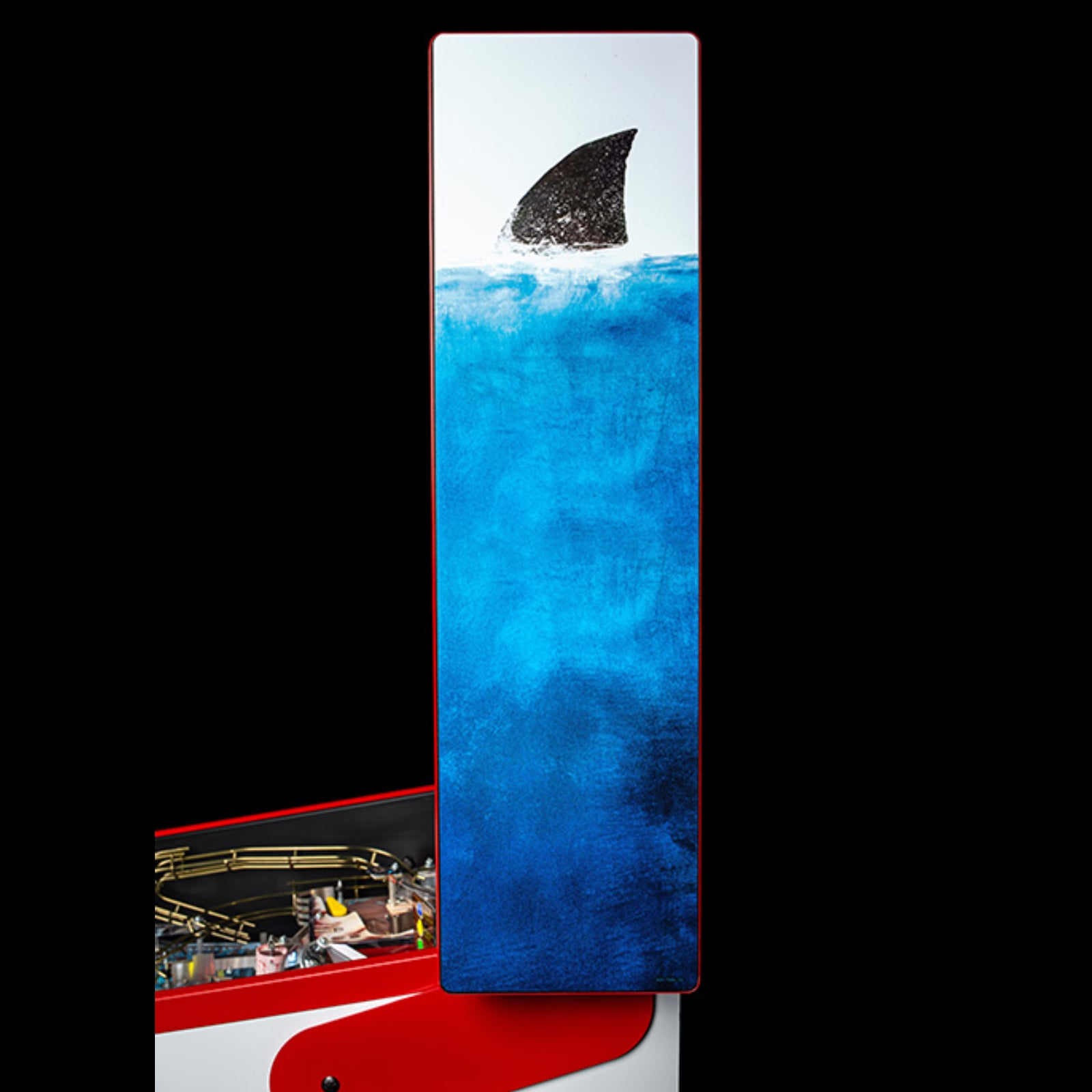 Nitro Pinball Sales Jaws 50th Annyversary Shark fin on a blue background with a blurred indoor setting