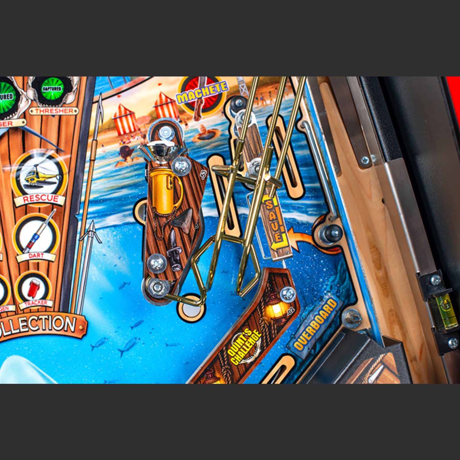 Nitro Pinball Sales Jaws 50th Annyversary Close-up of a pinball machine with detailed artwork and mechanical components.