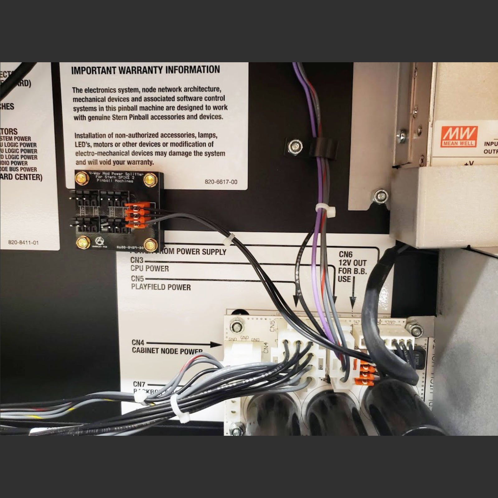 Nitro Pinball Sales Parts & Accessories Close-up of electronic equipment with wiring and a label on a black background